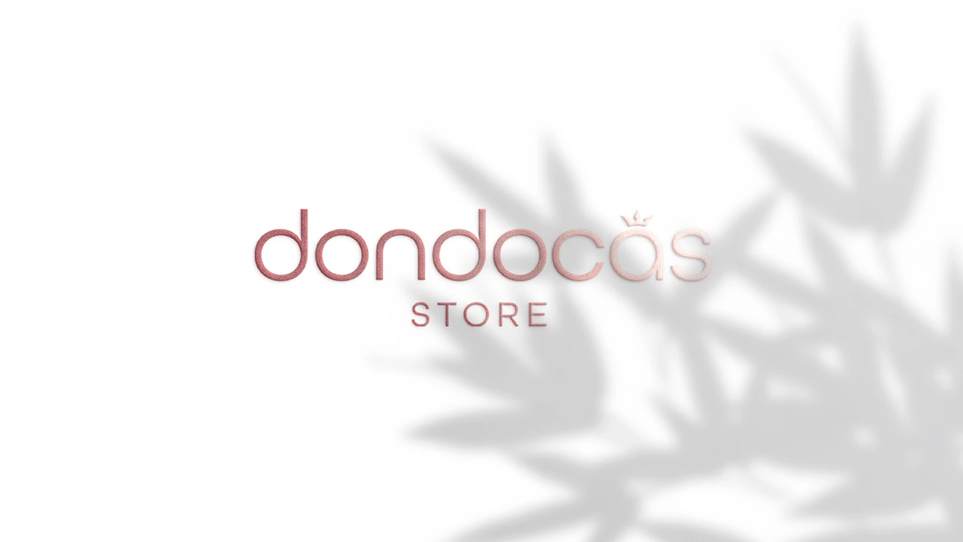Logotipo Dondocas Store em rosa suave, sobre fundo branco com sombras de folhas